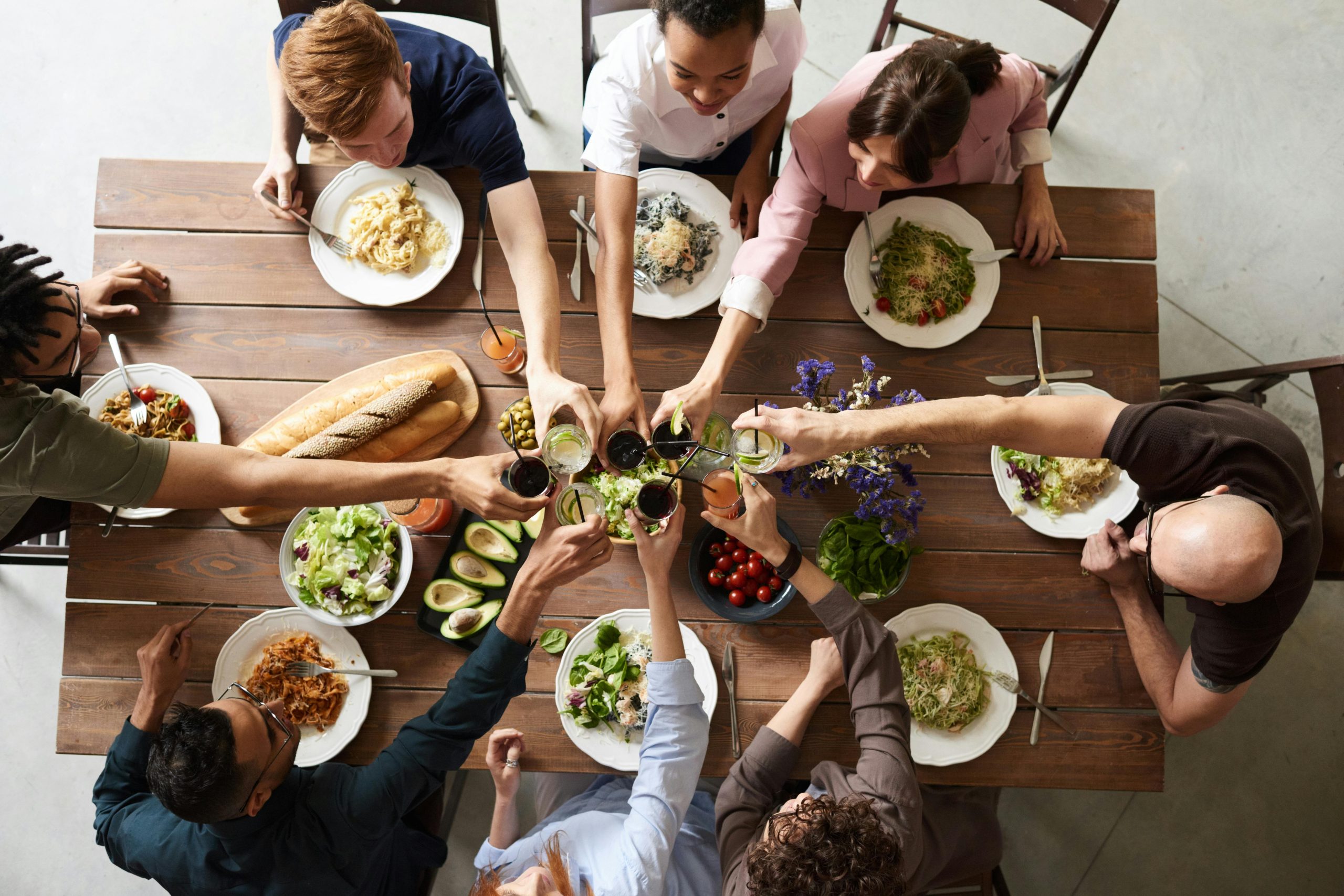 8 people enjoying Thanksgiving dinner
