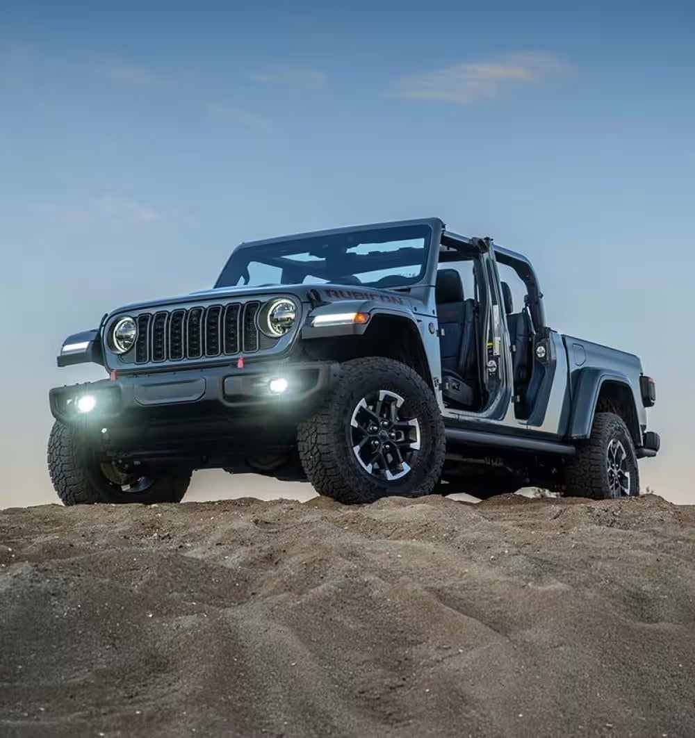Jeep on top of a mountain at sunset